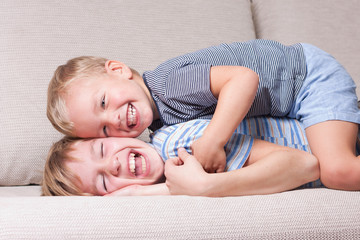 Two brothers laugh.