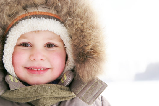 Cute Boy In Snowsuit