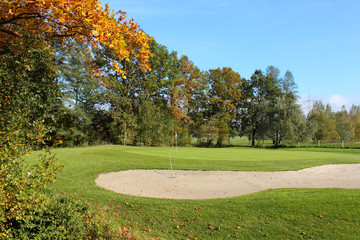 golf course and colorful trees in fall