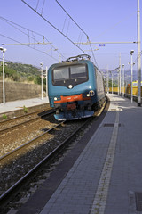 Fototapeta na wymiar A train leaving the sunny station, Pisciotta, Italy