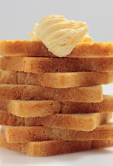 Piled toast bread slices with butter