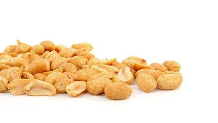 salted peanuts over white background