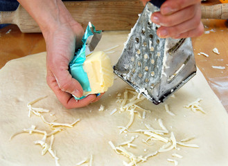 Grated butter on dough