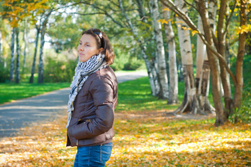 Portrait of a young beautiful woman on autumn walk