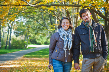 Fototapeta premium Romantic young beautiful couple on autumn walk