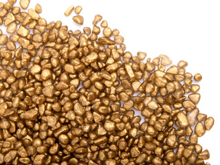 golden stones on white background with copy space.
