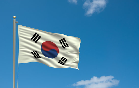 Flag of South Korea waving in the wind in front of blue sky