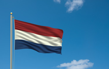 Fototapeta na wymiar Flag of the Netherlands waving in the wind in front of blue sky