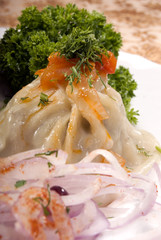 Dough stuffed with minced meat and served with salad