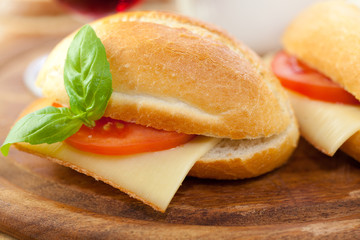 Sandwiches with french hard cheese and tomato