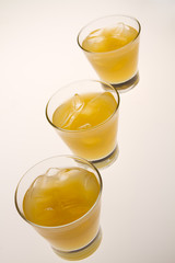 glass of orange juice with ice