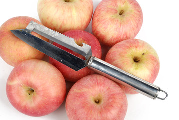 Red apples with knife on white bckground