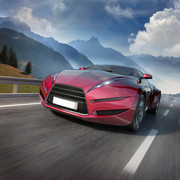 Red Sports Car Moving On The Mountain Road