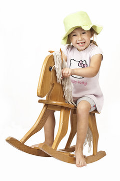 little girl and rocking horse