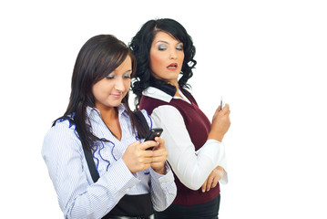 Woman looking sideways at her friend phone