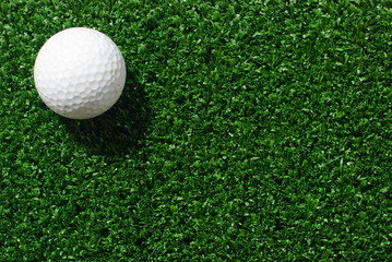 Golf ball on green grass