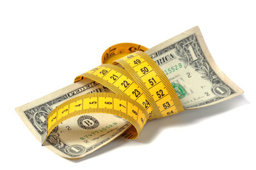 Dollar banknote and measure tape