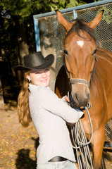 Young woman with her horse