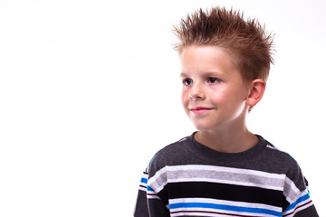Cute young boy smiling looking off camera