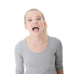 Young blond woman shouting