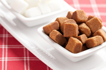 brown and white cubes of sugar