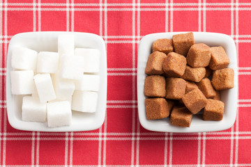 brown and white cubes of sugar