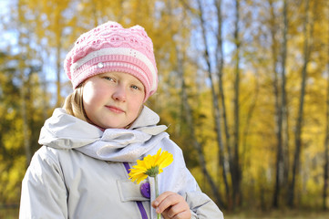 little girl with a yellow flower