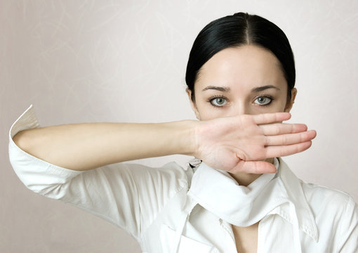 A young girl nurse hand covering the face