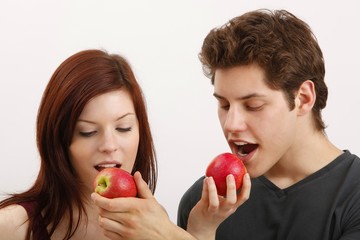 young couple with apples