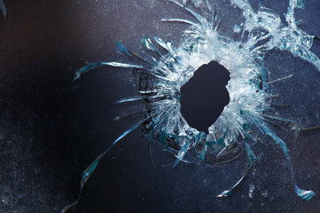 a bullet hole is in glass