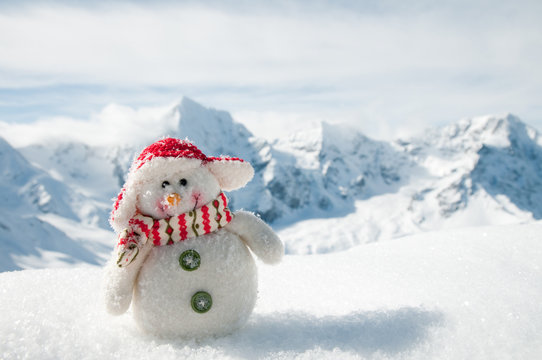 Happy snowman in mountain