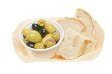 Olives and bread in a basket