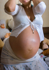 Cute happy pregnant girl smiling