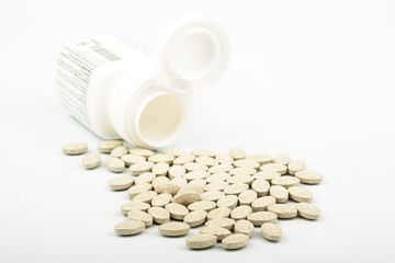 grassy tablets with a jar