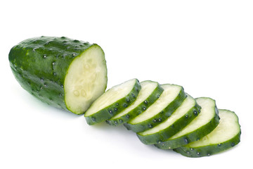 Cucumber and slices isolated over white background
