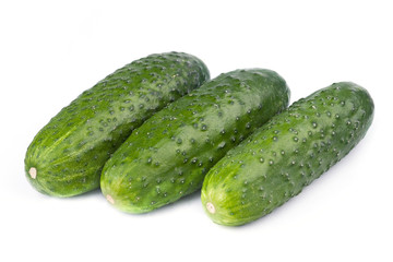 A fresh green cucumber isolated on a white background