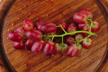red grape on wood