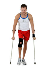 Young  attractive caucasian man athlete, crutches