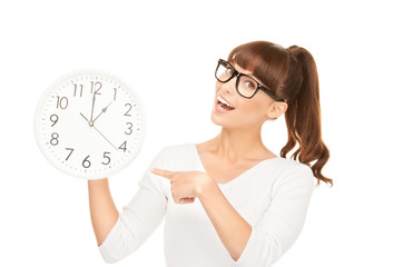 woman holding big clock
