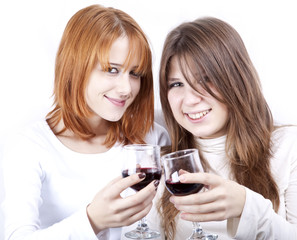 Two girlfriends with two glasses of wine.