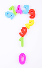 colorful plastic "what" symbol on white background