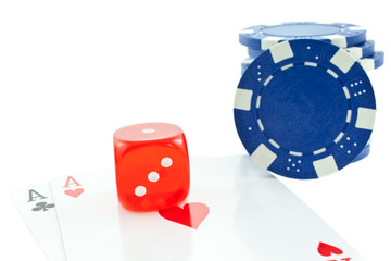 poker chips, cards and red dice cube isolated on white backgroun