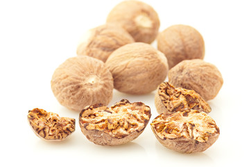 Nutmeg spice over white background