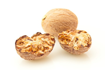 Nutmeg spice over white background