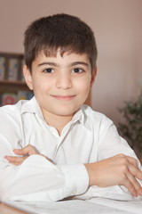 Smiling pupil with a copybook