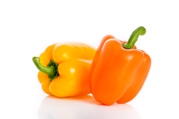 Mix of yellow and orange paprika isolated with reflection