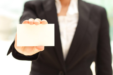 Business woman holding business card