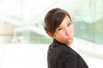 Young business woman showing tongue!