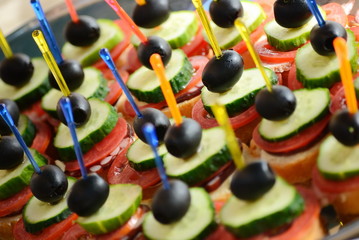 canapes cucumber, tomatoes and olives
