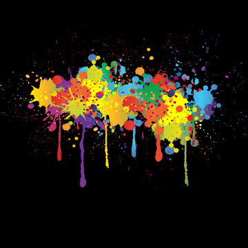 Colorful bright ink splashes on black background